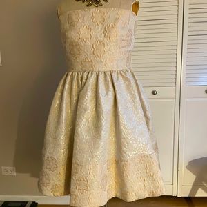 Cream dress, knee length, strapless with optional straps